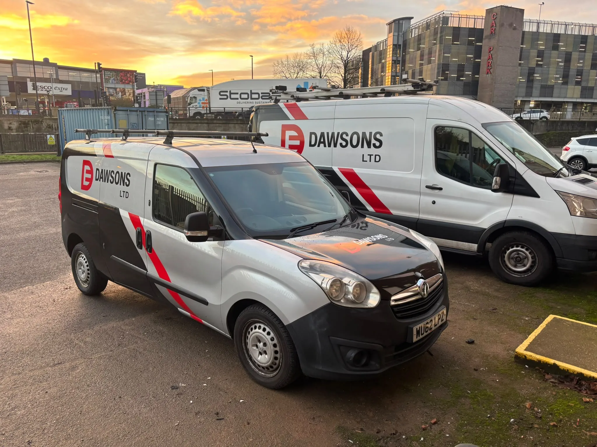 Two liveried Dawsons Ltd vans parked at first light